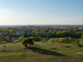 View over old town of Cracow from Krakus mound. In the front people relaxing on the grassland. Wide shot