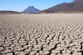 View over parched and empty dam, with cracked mud Royalty Free Stock Photo