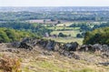 A view over Precambrian rock outcrops towards the city of Leicester in Bradgate Park, Leicestershire, UK