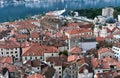 The view over red tiles roofs of the old center of Kotor, Montenegro, and the bay from the ancient fortress wall