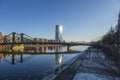 View over river Main in Frankfurt with Floesser Bridge and European Central Bank building with sun reflection in the Royalty Free Stock Photo