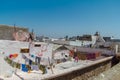 View over the roofs of houses with different clothes after washing in the old arabic town of Essaouira Royalty Free Stock Photo