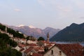 View over the roofs of old houses on the bell tower of the church on the seashore. Perast, Montenegro Royalty Free Stock Photo