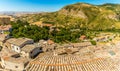 A view over the rooftops of the hilltop village of Petralia Sottana towards the limestone peaks of the Madonie Mountains, Sicily Royalty Free Stock Photo
