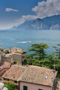 View over the rooftops of Malcesine to Lake Garda and the Alps in Italy Royalty Free Stock Photo