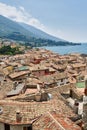 View over the rooftops of Malcesine to Lake Garda and the Alps in Italy Royalty Free Stock Photo