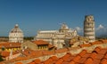 A view over the rooftops of Pisa towards the Cathedral Square, featuring the Cathedral, the Tower & the Baptistry, taken just afte Royalty Free Stock Photo