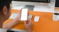 Businessman sitting at office desk and using mobile phone. Royalty Free Stock Photo