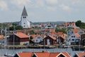 View over a small swedish village and a church with a smiling face
