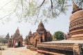 View over stupas and pagodas of ancient Bagan temple complex during sunrise golden hour in Myanmar Royalty Free Stock Photo