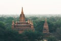 View over ancient temples of Bagan complex during sunrise golden hour in Myanmar Royalty Free Stock Photo