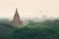 View over ancient temples of Bagan complex during sunrise golden hour in Myanmar Royalty Free Stock Photo