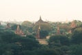 View over ancient temples of Bagan complex during sunrise golden hour in Myanmar Royalty Free Stock Photo