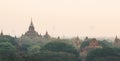 View over ancient temples of Bagan complex during sunrise golden hour in Myanmar Royalty Free Stock Photo