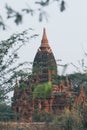 View over stupas and pagodas of ancient Bagan temple complex during sunrise golden hour in Myanmar Royalty Free Stock Photo