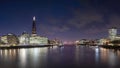 View over the Thames as night falls, taking in The north Bank, HMS Belfast,The Scoop, The Shard and City Hall
