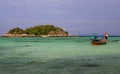 View over turquoise bay contrasting with blue sky on tiny  island with long tail boats on Ko Lipe, Thailand Royalty Free Stock Photo