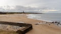 View over Tynemouth Longsands, Tynemouth, UK, with the old outdoor swimming pool in the foreground Royalty Free Stock Photo