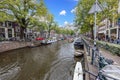 View over a typical canal in the Dutch metropolis Amsterdam in summer 2023