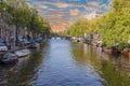 View over a typical canal in the Dutch metropolis Amsterdam in summer 2023