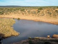 View over waterhole at sunset in the Addo Elephant Park, South A Royalty Free Stock Photo