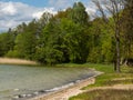 View over Wielewskie lake and beach, sunny day. Blue sky with some white clouds.