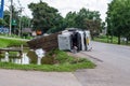 A view of an overturned truck on an highway in an accident