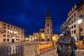 View of Oviedo Cathedral at dusk with La Regenta statue on foreground