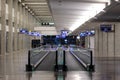 View at a pair of empty moving walkways in long hall of an airport Royalty Free Stock Photo