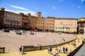 Tourist near Palazzo Publico in Piazza del Campo Town hall of Siena, Tuscany, Italy Royalty Free Stock Photo