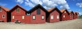 red typical ish cabins under blus sky in sweden