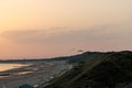 View of parachutes flying at the beach under the purple sunset sky Royalty Free Stock Photo