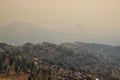 View from a paraglider to the valley and Lake Pheva in Pokhara, Himalayas. Rice fields, mountains and small houses. Tilt Shift Eff