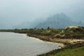 View from a paraglider to the valley and Lake Pheva in Pokhara, Himalayas. Rice fields, mountains and small houses. Tilt Shift Eff