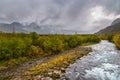 Paratunka River, the forest in autumn colors, Russia.pylon Royalty Free Stock Photo