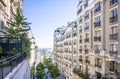 View of Paris through the houses on a hill on Montmartre