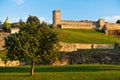 A view from a park to Kalemegdan fortress walls and towers at sunset, Belgrade