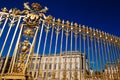 View of the part of a north wing of the Palace of Versailles across his gilding fence