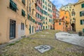 View of a part of old city called `Campo Pisano`, a square with colorful houses in Genoa, Italy Royalty Free Stock Photo