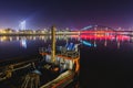 View at the part of an old ship, old railway bridge and distant city lights at night, Belgrade, Serb Royalty Free Stock Photo