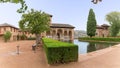 View at the Partal Palace or Palacio del Partal , a palatial structure around gardens and water lake inside the Alhambra fortress