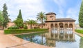 View at the Partal Palace or Palacio del Partal , a palatial structure around gardens and water lake inside the Alhambra fortress Royalty Free Stock Photo
