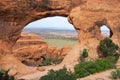 View through Partition arch in Arches National Park, Utah, USA. Natural sandstone arch formation created by erosion Royalty Free Stock Photo