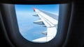 View from passenger seat on airplane wing above clouds Royalty Free Stock Photo