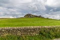 A view past a dry stone wall towards the Almscliffe crag in Yorkshire, UK Royalty Free Stock Photo