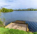 A view past a fishing spot on Welford Reservoir, UK Royalty Free Stock Photo