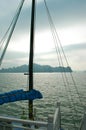 View past the mast of a boat to the islands of Halong Bay, Vietnam. Royalty Free Stock Photo