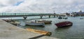 A view past old boats moored on the River Adur at Shoreham, Sussex, UK