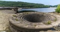 A view past the overflow plughole on Ladybower reservoir, Derbyshire, UK