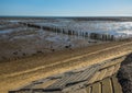 A view past sea defenses out to sea from the East Mersea flats, UK